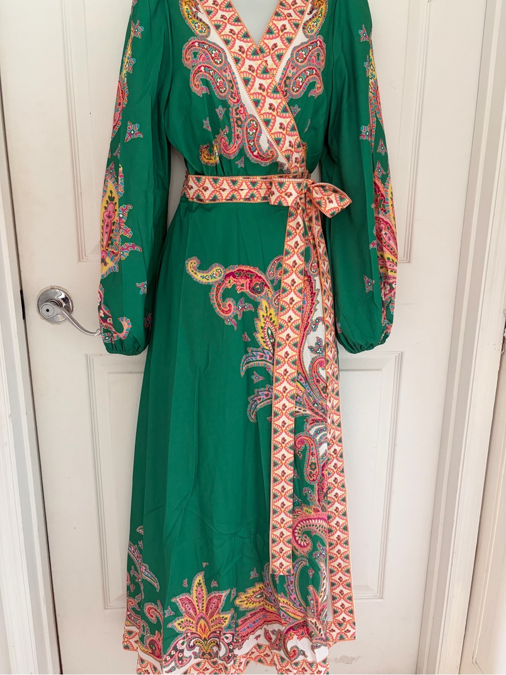 A NWT showstopper. Green paisley maxi wrap dress .Easily sizes up or down.